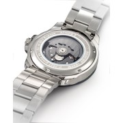 Dos de la montre laissant apparaitre le mécanisme de la montre, détails tricolores brodés sur le bracelet.