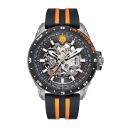 Montre en metal avec cadran noir découpé  laissant apparaitre le mécanisme de la montre.