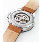 Dos de la montre avec mécanisme visible.