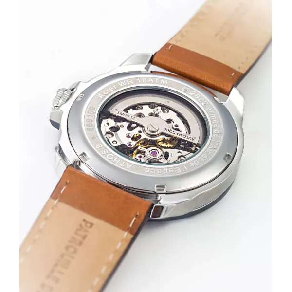 Dos de la montre avec mécanisme visible.