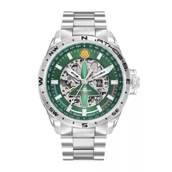 Montre en metal avec cadran vert découpé en forme d'alpha-jet laissant apparaitre le mécanisme de la montre.