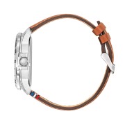 Profil de la montre avec bracelet en cuir marron et boutons en métal.