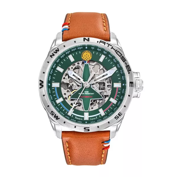 Montre en metal avec cadran vert découpé en forme d'alpha-jet laissant apparaitre le mécanisme de la montre.