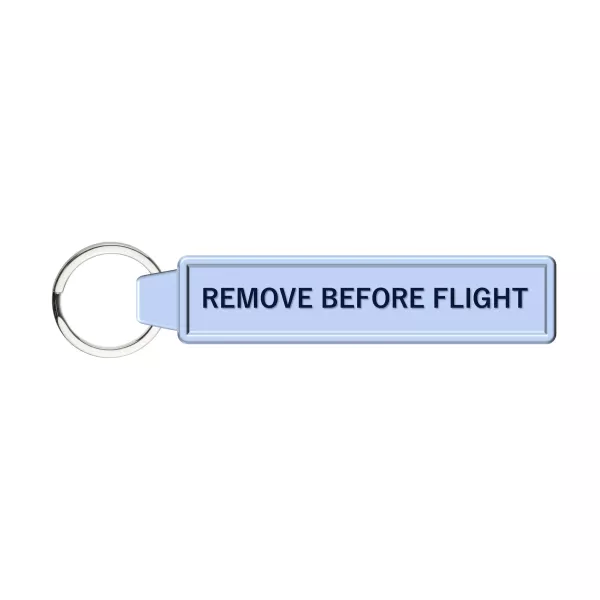 Revers du porte clé avec mention "Remove before flight"