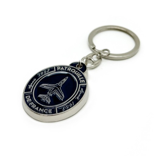 Porte-clé en métal et visuel bleu marine de l'alpha-jet de l'inscription "Patrouille de France"