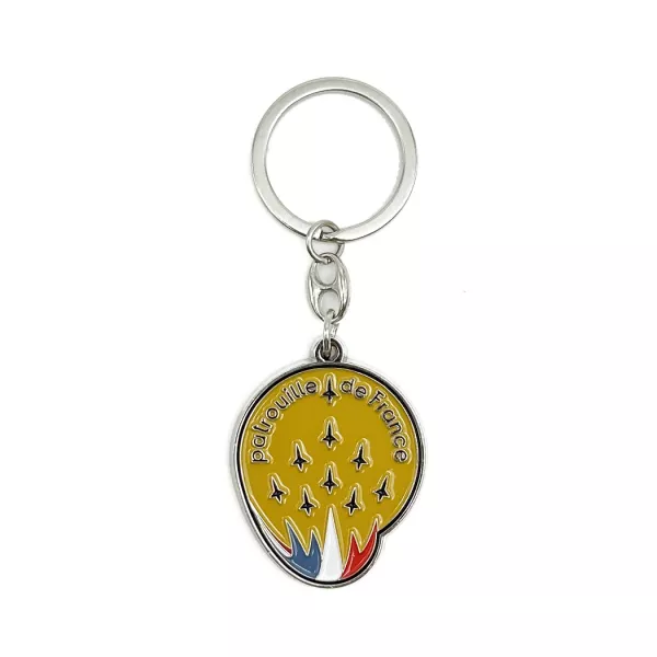 Insigne découpée à la forme, sur fond jaune.