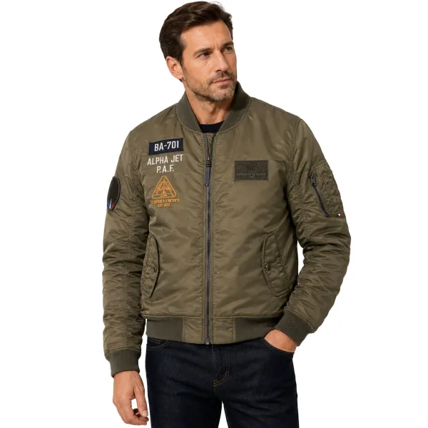 Bombers vert kaki avec inscription "alpha Jet" sur la poitrine. Doublure orange