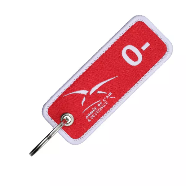 Porte-clés en tissu rouge tissé recto/verso en blanc avec : le logo de l'armée de l'Air & de l'Espace et le groupe sanguin : O-